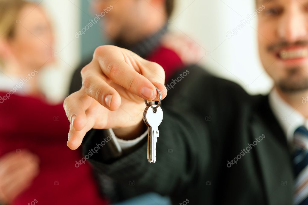 Person receiving keys to a new apartment during relocation